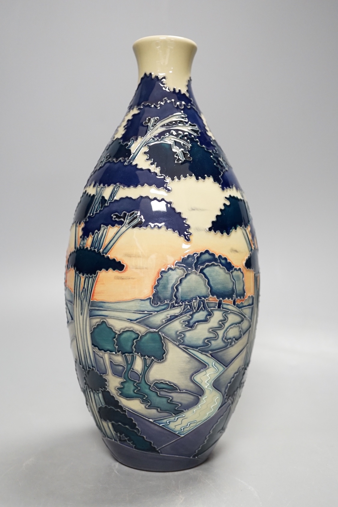 A Moorcroft 'trees in a landscape' trial vase, boxed, 23cms high.